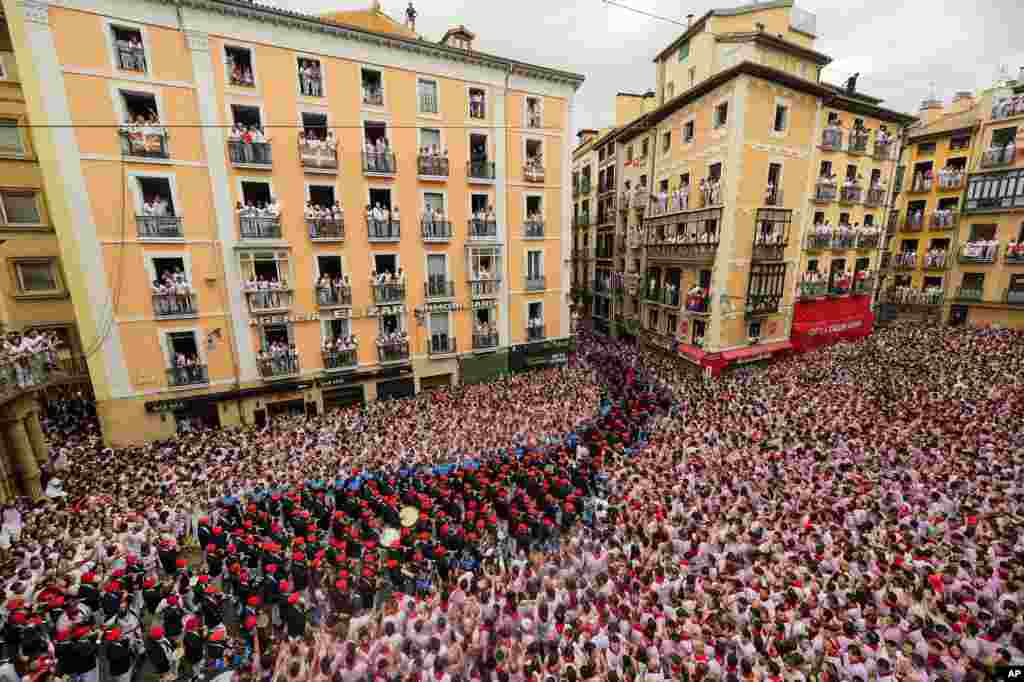 A music band plays in the town hall square after the 'Chupinazo' rocket, to mark the official opening of the 2023 San Fermín fiestas in Pamplona, Spain, July 6, 2023. 