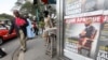FILE - A man looks at posters of weekly news magazine Jeune Afrique in Abidjan, Ivory Coast, Dec. 21, 2010. The French publication was suspended in Burkina Faso on Sept. 25, 2023, after the country's military junta accused it of manipulating information to "spread chaos." 