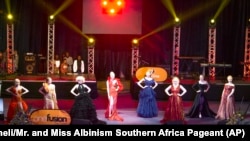 In this photo supplied by pageant organizer John Karimazonde, contestants compete in the Mr. and Miss Albinism Southern Africa Pageant at the Harare International Conference Centre, Oct. 14, 2023. 