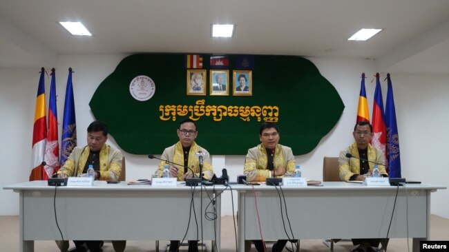 FILE - Members of the Constitutional Council of Cambodia announces the election disqualification of the Candlelight Party for the upcoming election in Phnom Penh, Cambodia, May 25, 2023.