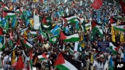 FILE - Thousands of supporters take part in a rally to show solidarity with Palestinians in Islamabad, Pakistan, on Oct. 29, 2023. As he spoke about civil rights in Lahore on April 27, 2024, German Ambassador Alfred Grannas was interrupted by pro-Palestinian demonstrators.