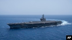 The USS aircraft carrier Dwight D. Eisenhower, also known as 'IKE', sails in the Red Sea on June 12, 2024. 