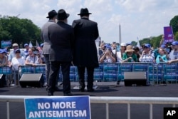 FILE - People attend the "NO FEAR: Rally in Solidarity with the Jewish People" event in Washington, July 11, 2021, co-sponsored by the Alliance for Israel, Anti-Defamation League, American Jewish Committee, B'nai B'rith International and other organizations.