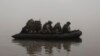 FILE - Ukrainian marines sail along the Dnipro river at the front line near Kherson, Ukraine, Oct. 14, 2023. 