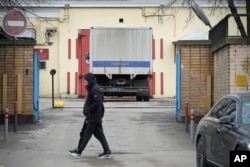 FILE - A man walks past an entrance of the Lefortovo prison, in Moscow, March 30, 2023.