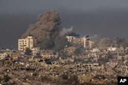 Smoke rises following an Israeli bombardment in the Gaza Strip, as seen from southern Israel, Nov. 23, 2023.