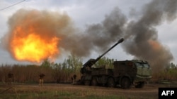 Gunners from 43rd Separate Mechanized Brigade of the Armed Forces of Ukraine fire at Russian position with a 155 mm self-propelled howitzer 2C22 'Bohdana', in Kharkiv region, Apr. 21, 2024