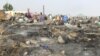 Vue générale des destructions causées par un incendie dans le camp de Muna Alamdiri, près de Maiduguri, le 15 novembre 2023. (Photo Audu MARTE / AFP)