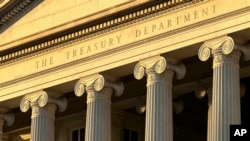 FILE - The Treasury Department is seen in Washington, Jan. 18, 2023. The U.S. on April 23, 2024, sanctioned four people and two companies for "malicious cyber activity" on behalf of Iran's military.