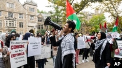 FILE - Pro-Palestinian demonstrators gather to protest University of Michigan President Santa Ono's "Statement regarding Mideast violence" outside the University of Michigan President's House, Oct. 13, 2023, in Ann Arbor, Mich. 