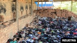 Waste from international clothing brands is stored before being used to fuel kilns at a brick factory on the outskirts of Phnom Penh, Cambodia November 17, 2023. (LICAHDO via REUTERS)