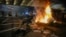 A bonfire burns as Israelis occupy the Ayalon Highway to protest against plans by Prime Minister Benjamin Netanyahu's government to overhaul the judicial system, in Tel Aviv, July 20, 2023.