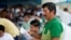 A man takes part in a referendum that asks voters to support mostly security-related questions to fight rising violence, in Nobol, Guayas province, Ecuador, April 21, 2024. 