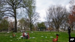 People gathered for an Eid al-Fitr celebration in the U.S. state of Pennsylvania left chairs and other items behind as they fled upon hearing gunshots in the park, April 10, 2024.