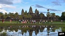 FILE - Tourists visit the Angkor Wat temple in Siem Reap province, Cambodia, Nov. 16, 2023. 