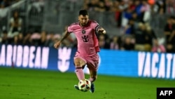 FILE - Inter Miami's Argentine forward #10 Lionel Messi vies for the ball during a friendly football match between Inter Miami CF and Newell’s Old Boys at DRV PNK Stadium in Fort Lauderdale, Florida, Feb. 15, 2024.