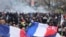 Flags are seen during a demonstration as part of the 10th day of nationwide strikes and protests against French government's pension reform in Paris, France, March 28, 2023.