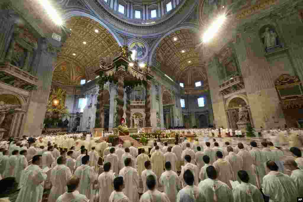 Pope Francis celebrates the Chrism Mass where the chrism, the oil of the catechumens and the oil of the sick, are consecrated and all the priests renew the promises made on the day of their ordination, inside St. Peter's Basilica, at the Vatican.