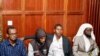 FILE - Suspects Hassan Edin Hassan, Mohamed Abdi Abikar, Rashid Charles Mberesero and Sahal Diriye sit in the dock as they wait for the verdict where they were charged with helping those who carried out the attack on Garissa University, June 19, 2019. 