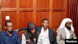 FILE - Suspects Hassan Edin Hassan, Mohamed Abdi Abikar, Rashid Charles Mberesero and Sahal Diriye sit in the dock as they wait for the verdict where they were charged with helping those who carried out the attack on Garissa University, June 19, 2019. 