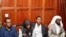 FILE - Suspects Hassan Edin Hassan, Mohamed Abdi Abikar, Rashid Charles Mberesero and Sahal Diriye sit in the dock as they wait for the verdict where they were charged with helping those who carried out the attack on Garissa University, June 19, 2019. 