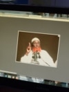 FILE - A man looks at a computer screen displaying an image of Islamic State Somalia leader Abdulqadir Mumin in Nairobi, Kenya, on Sept. 1, 2016. A report released Sept. 12, 2024, says Mumin could become the first Africa-based leader of the overall Islamic State terrorist group.