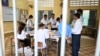 Election officials count ballots at a polling station in Phnom Penh on July 23, 2023 during the general elections. (Photo by TANG CHHIN SOTHY / AFP)