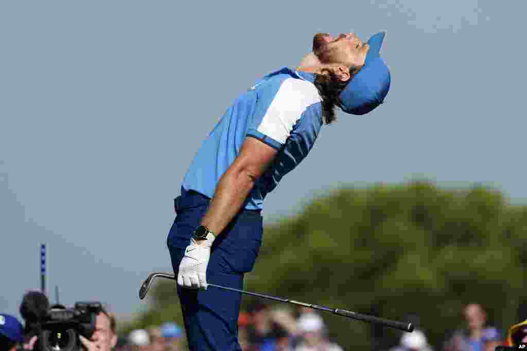 Europe's Tommy Fleetwood reacts after a chip onto the 10th green narrowly missed going holing out during his morning Foursome match at the Ryder Cup golf tournament at the Marco Simone Golf Club in Guidonia Montecelio, Italy.