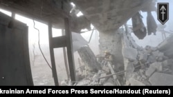 A Ukrainian soldier during the purported liberation of Andriivka, at a location given as Andriivka, Donetsk Region, Ukraine, in a screen grab from a video released on Sept. 16, 2023. (3rd Assault Brigade/Ukrainian Armed Forces Press Service/Handout via Reuters)