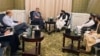 Zabihullah Mujahid of Afghanistan's Taliban government, center right, speaks with Russian envoy Zamir Kabulov in Doha, Qatar, June 30, 2024. The third round of talks on global engagement with the Taliban ended July 1. (Taliban spokesman's office via AP)