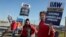 Striking United Auto Workers members hold signs outside the Stellantis Jeep plant in Toledo, Ohio, Sept. 19, 2023. 