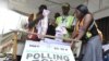 FILE - Officials of the Independent National Electoral Commission (INEC) count votes at a polling station after local elections, in Lagos, March 18, 2023.