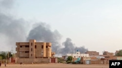 FILE - Smoke billows in the distance around the Khartoum Bahri district amid ongoing fighting in Sudan on July 14, 2023. 