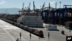 FILE - A freight train line at the port of Piraeus during its inauguration on June 20, 2014. Greece on Feb. 26, 2024, agreed to participate in and lead an EU security operation in the Red Sea, to protect commercial shipping from Houthi attacks. 