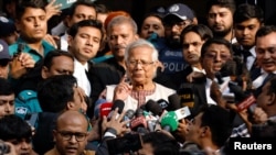 Bangladeshi Nobel peace laureate Professor Muhammad Yunus gestures in front of the court after being sentenced for six months of imprisonment and fined BDT 5,000 in a labor law violation case, in Dhaka, Bangladesh, Jan. 1, 2024. 
