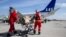 Ukrainian medical personnel transport a wounded soldier to a medical evacuation (Medevac) airplane, a specially-adapted Boeing 737, for a flight carried out by Norway in collaboration with the European Union in Rzeszow, Poland on March 22, 2023.
