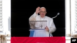 Pope Francis delivers his blessing as he recites the Regina Coeli noon prayer from the window of his studio overlooking St.Peter's Square, at the Vatican, Apr. 16, 2023. 