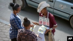 FILE - A vendor sells mobile phone credit cards on a street in Addis Ababa, Ethiopia, Nov. 3, 2022. Ethiopia, which had imposed internet shutdowns because of ethnic unrest in the country, recently lifted its restrictions.