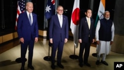 FILE - U.S. President Joe Biden, from left, Australia's PM Anthony Albanese, Japan's PM Fumio Kishida, and India's PM Narendra Modi hold a Quad meeting on the sidelines of the G7 summit, at the Grand Prince Hotel in Hiroshima, western Japan, May 20, 2023.