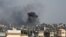 Smoke rises after an Israeli airstrike, amid the ongoing conflict between Israel and Palestinian Islamist group Hamas, in Khan Younis, southern Gaza Strip, December 9, 2023. 