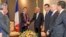 This photo released by Sri Lanka President's office shows Sri Lankan President Ranil Wickermesinghe shakes hands with his French counterpart, Emmanuel Macron, in Colombo, Sri Lanka, July 28, 2023. 