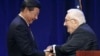 FILE - Chinese President Xi Jinping, left, shakes hands with former U.S. National Security Adviser and Secretary of State Henry Kissinger in Seattle, Washington, Sept. 22, 2015.