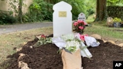 Flowers lie at the grave of Nahel Merzouk on July 5, 2023, in a cemetery in Nanterre, a Paris suburb. Nahel's death at the hands of police caused five nights of unrest in France.