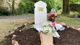Flowers lie at the grave of Nahel Merzouk on July 5, 2023, in a cemetery in Nanterre, a Paris suburb. Nahel's death at the hands of police caused five nights of unrest in France.