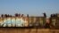 Migrants ride on a train towards Ciudad Juarez, in La Escuadra, Chihuahua, Mexico. March 28, 2023.