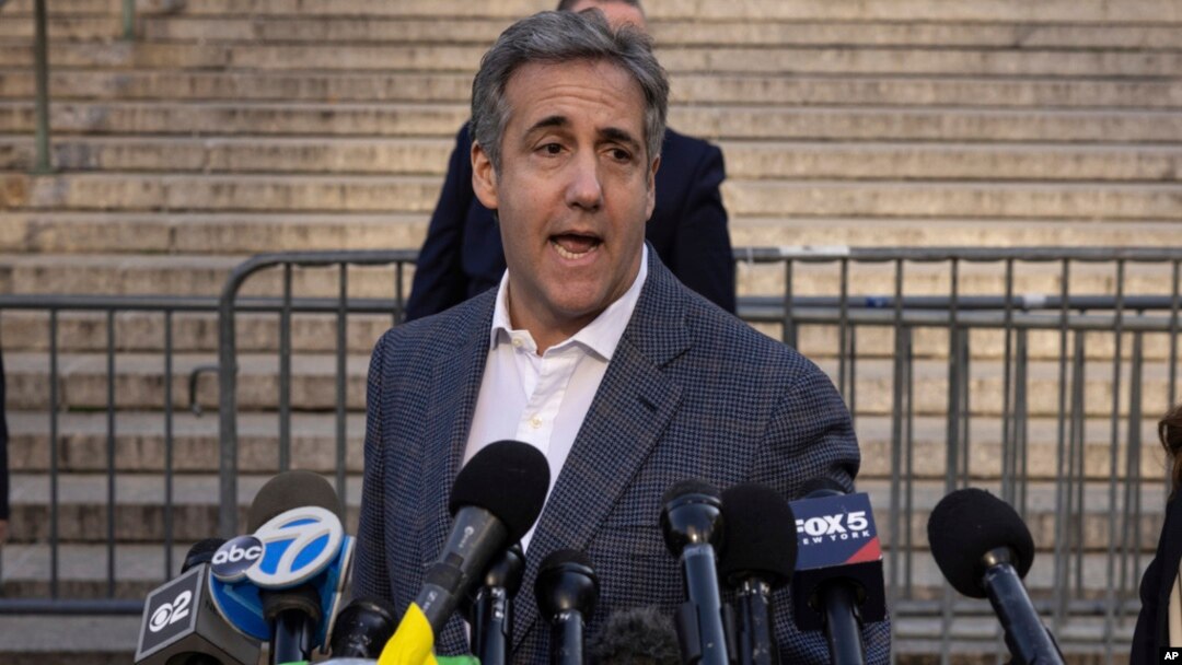 Michael Cohen speaks to members of media as he arrives for former President Donald Trump's civil business fraud trial at New York Supreme Court, Oct. 24, 2023.