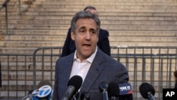 FILE - Michael Cohen speaks to reporters as he arrives for former President Donald Trump's civil business fraud trial at New York Supreme Court, Oct. 24, 2023.