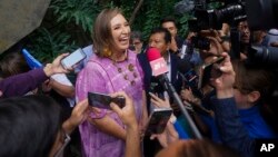 FILE - Senator Xochitl Galvez, an opposition presidential hopeful, speaks to the press after registering her name as a candidate in Mexico City, July 4, 2023.