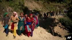 Survivors participate in a funeral of those killed in earthquake in Jajarkot district, northwestern Nepal, Nov. 5, 2023.