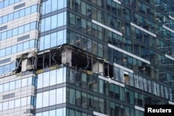 FILE - A view shows the damaged facade of an office building following a reported Ukrainian drone attack in Moscow, Russia, July 30, 2023.